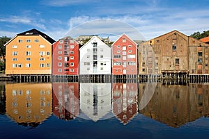 Trondheim, colorful wooden houses along the banks of the fjord