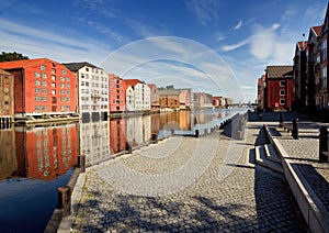 Trondheim, colorful wooden houses along the banks of the fjord