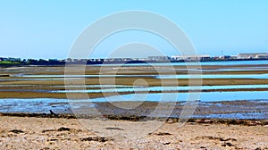 Troon Shore, South Ayrshire, Scotland, looking south towards Troon Marinae Island of Arranarassie