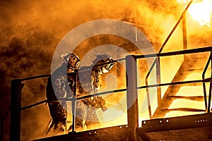 A troop of firefighters attacking