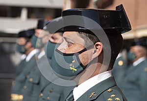 Troops forming wearing protective face mask