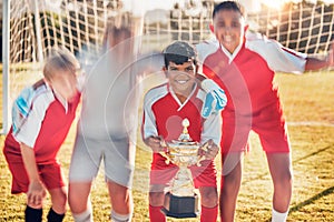 Trophy, soccer and team in celebration of success as winners of a sports award in a childrens youth tournament. Happy