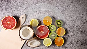 Tropic fruits appear and disappear next to cutting board - Stop motion