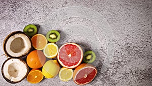 Tropic fruits, oranges, kiwi, coconut, lemon appear - Stop motion