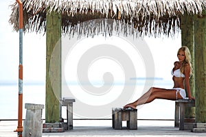 Tropic woman on the veranda photo