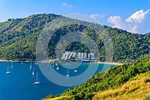 Tropical bay at Naiharn and Ao Sane beach with boats at windmill viewpoint, Paradise destination Phuket, Thailand