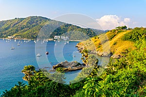 Tropical bay at Naiharn and Ao Sane beach with boats at windmill viewpoint, Paradise destination Phuket, Thailand photo