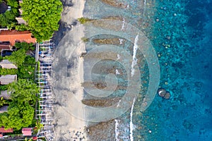 The tropical bay with sandy and stony beach, boats. Amed, Bali, Indonesia. photo