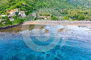 The tropical bay with stony beach, boats. Amed, Bali, Indonesia. photo