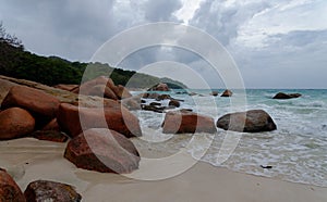 Tropical beach Anse Georgette at Praslin island, Seychelles, on cloudy day