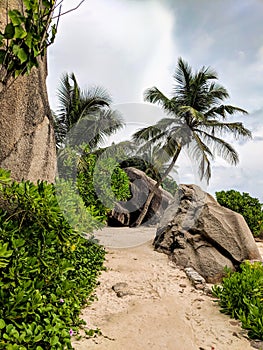 Tropical beach Anse Source d`Argent with granite boulders at sunset, La Digue Island, Seychelles