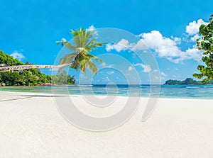 Tropical beach Baie Lazare with boat, Mahe island, Seychelles photo