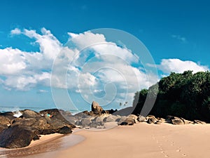 Tropical beach with boulders. Ambalangoda, Sri Lanka