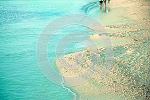 Tropical beach coastline with clear blue water