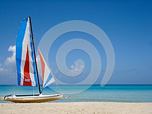 Tropical beach with colorful boat