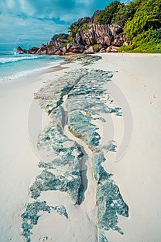 Tropical beach at Grand Anse, La Digue island, Seychelles. Beautifully shaped granite boulders, white sand and blue photo