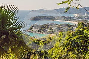 Tropical beach landscape panorama. Beautiful turquoise ocean waives with boats and sandy coastline from high view point. Kata and