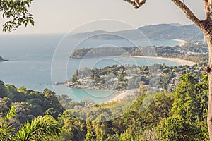 Tropical beach landscape panorama. Beautiful turquoise ocean waives with boats and sandy coastline from high view point. Kata and