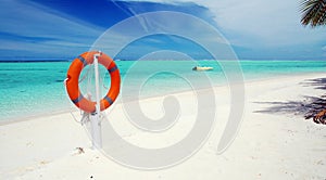 Tropical beach and lifebuoy panorama