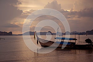 Tropical beach, long tail boats,golden sunset, gulf of Thailand,Krabi