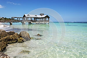 Tropical Beach with old abandoned pier.