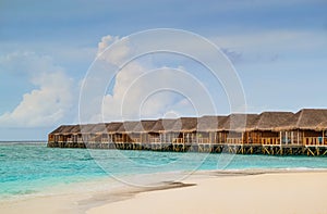 Tropical Beach with Overwater Bungalows