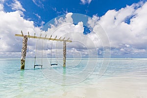 Tropical beach panorama as summer landscape with couple beach swing or hammock white sand and calm sea for beach scenic banner