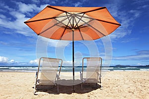 Tropical beach with parasol photo