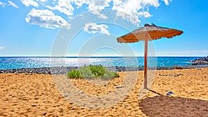 Tropical beach with parasol photo