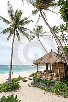 Tropical beach resort with bamboo hut photo