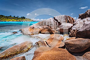 Tropical beach at Seychelles. Rocks on shore of La Digue Island