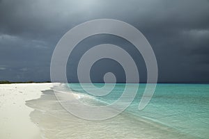 Tropical beach and strom clouds on Little CuraÃ§ao