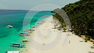 Tropical beach and turquoise lagoon water