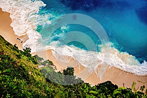 Tropical beach. Turquoise water. White sand beach. Paradise island. View from above looking down the cliff to the beach with blue
