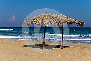 Tropical beach with umbrella in cyprus