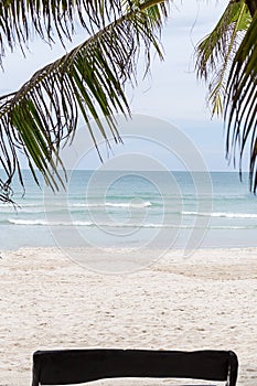 Tropical beach white sand view of the ocean landscape sunny paradise rest under the shadow of palm trees