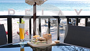 Tropical beachfront dining experience featuring refreshing