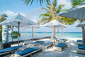 Tropical beautiful landscape of five stars luxury resort with umbrellas and sunbeds