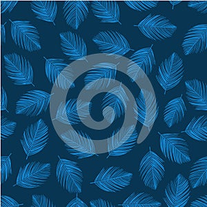 Tropical blue palm tree leaves in a seamless pattern