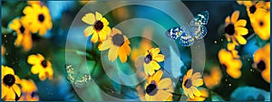 Tropical butterflies and yellow bright summer flowers on a background of colorful  foliage in a fairy garden. Macro artistic image