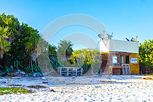 Tropical Caribbean beach people parasols fun Playa del Carmen Mexico