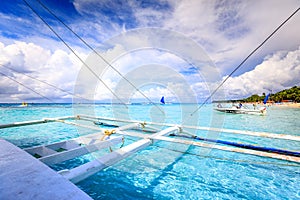 Tropical clear sea with dramatic sky view from Philippine traditional boat