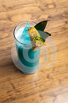 Tropical cocktails on wooden background. Frutal alcoholic cocktails. Colorful drinks concept