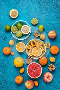 Tropical colorful summer fruits on blue background