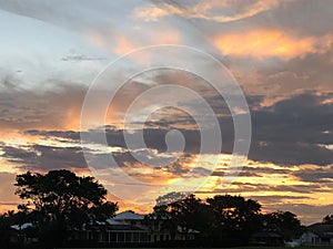 tropical colorful sunset at home in back yard