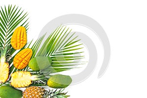 Tropical composition of pineapple and mango fruits with palm leaves on white background. Flat lay, top view. Copy space