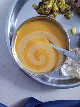 Tropical Delight: A Plate of Rich and Creamy Aamras Made with Fresh Mangoes