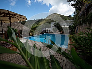 Tropical exotic holiday blue swimming pool in Amazon river jungle rainforest lodge hotel at Sauce Lagoon Tarapoto Peru photo