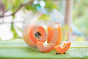 Tropical exotic papaya fruit and glass jar juice