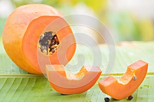 Tropical exotic papaya fruit and glass jar with smoothie shake j